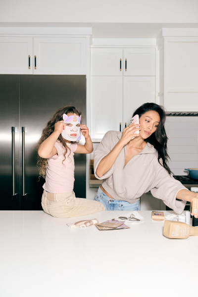 shay mitchell and her daughter model products from rini skin care line